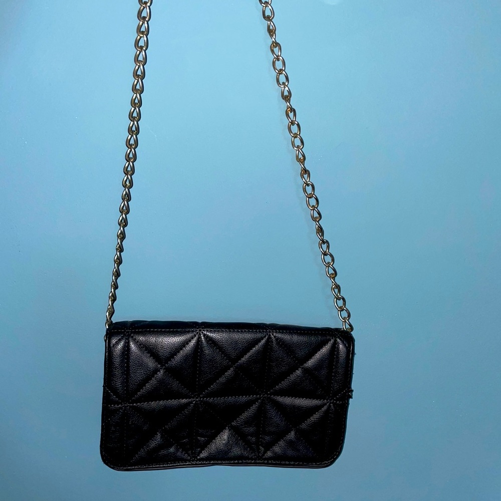 Black quilted shoulder bag with metal chain strap